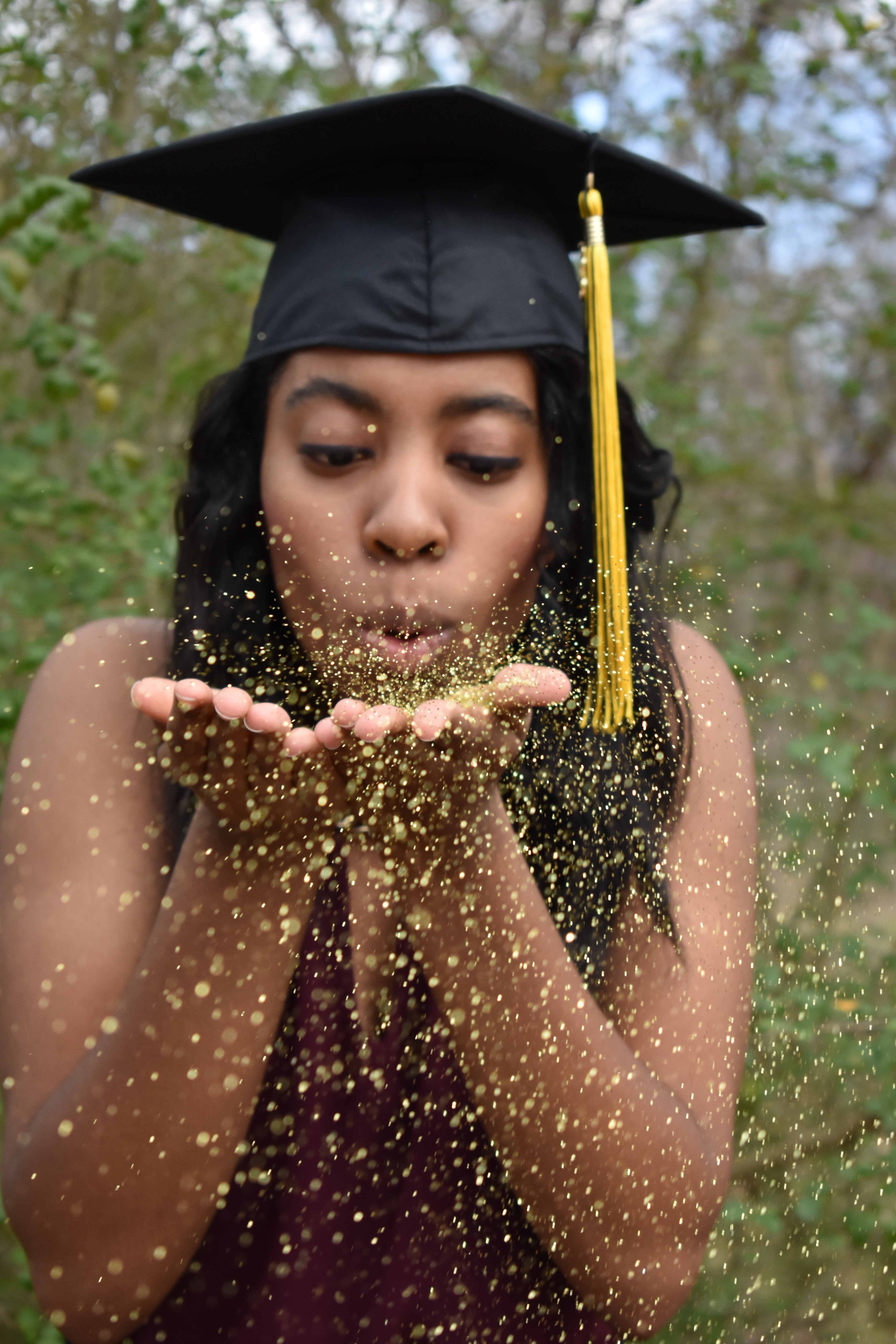 Girl in Graduation Cap and Gown